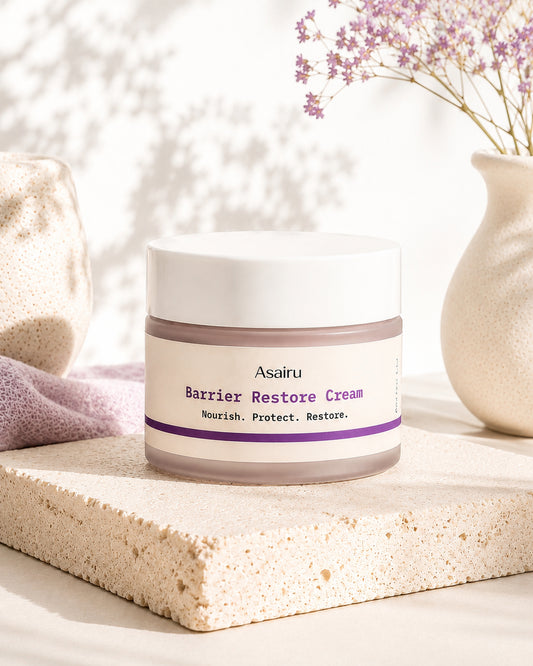 Barrier Restore Cream jar styled with dried flowers on stone surface