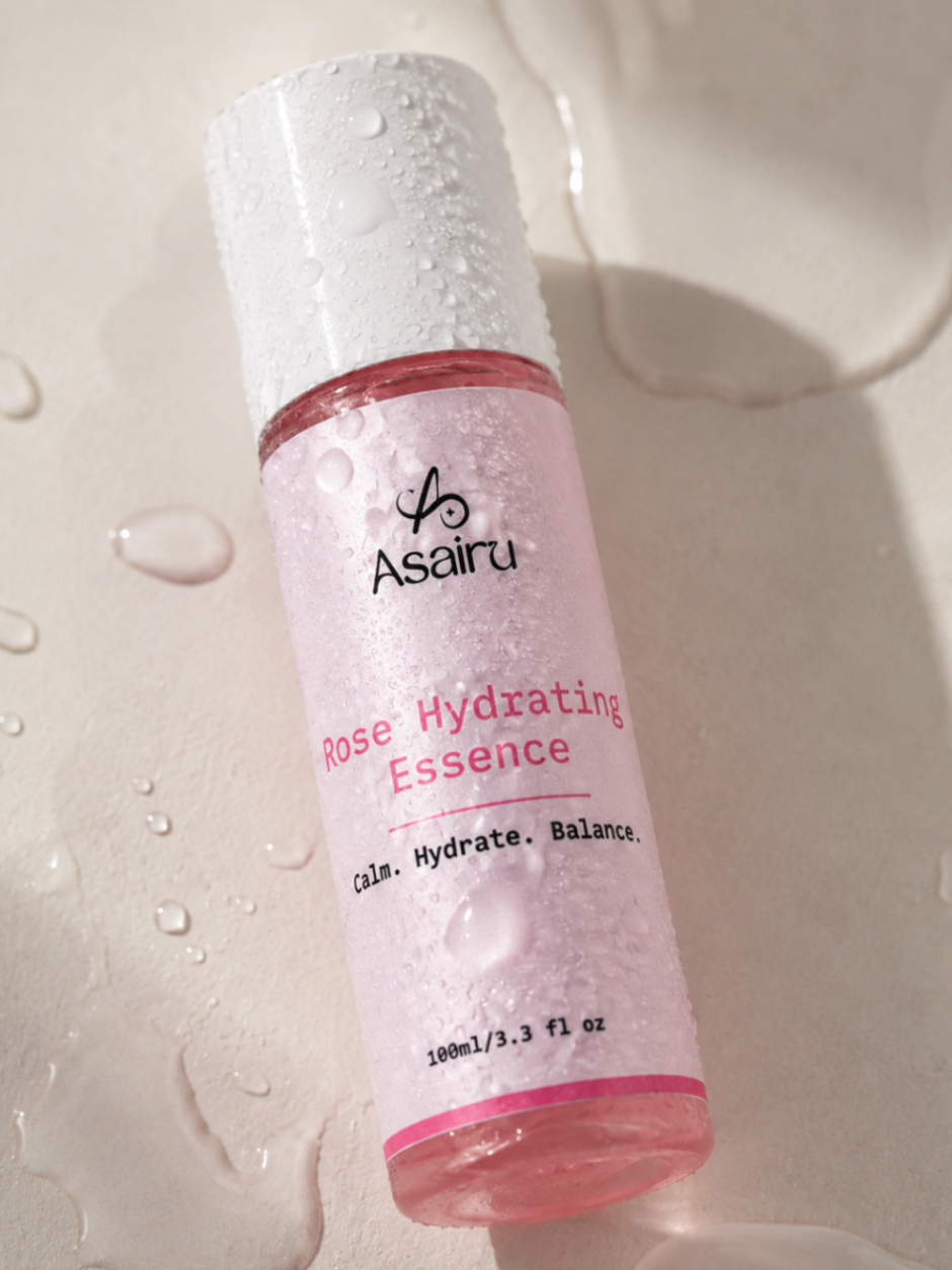 Rose Hydrating Essence bottle with water droplets, lightweight hydrating formula