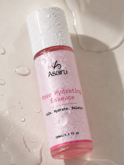Rose Hydrating Essence bottle with water droplets, lightweight hydrating formula